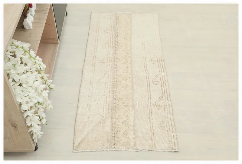 Full top view of the beige and tan vintage Anatolian runner rug