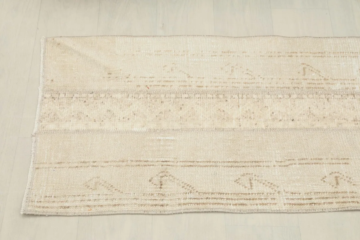 Overhead view showing the full length and pattern variation of the rug