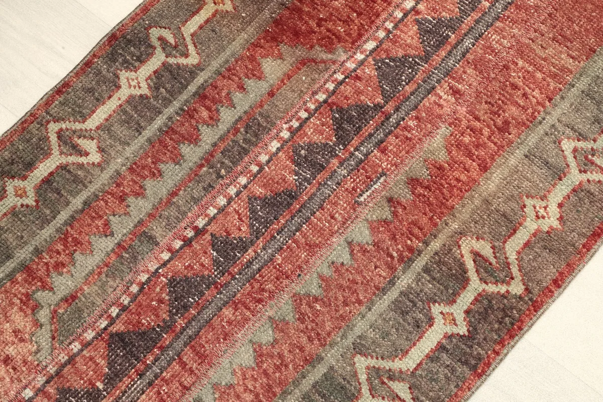 Angled view highlighting the tribal geometric patterns and color variations