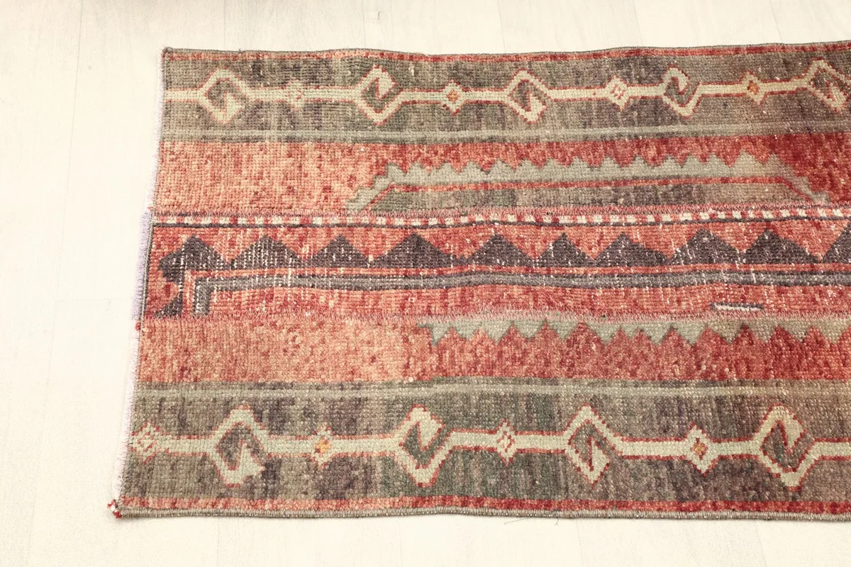 Overhead view of one half of the rug, showing the alternating pattern stripes