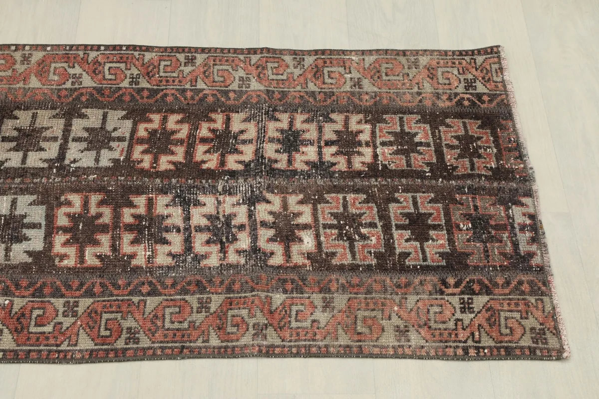 Overhead view of the other end of the rug, showcasing the consistent tribal motifs