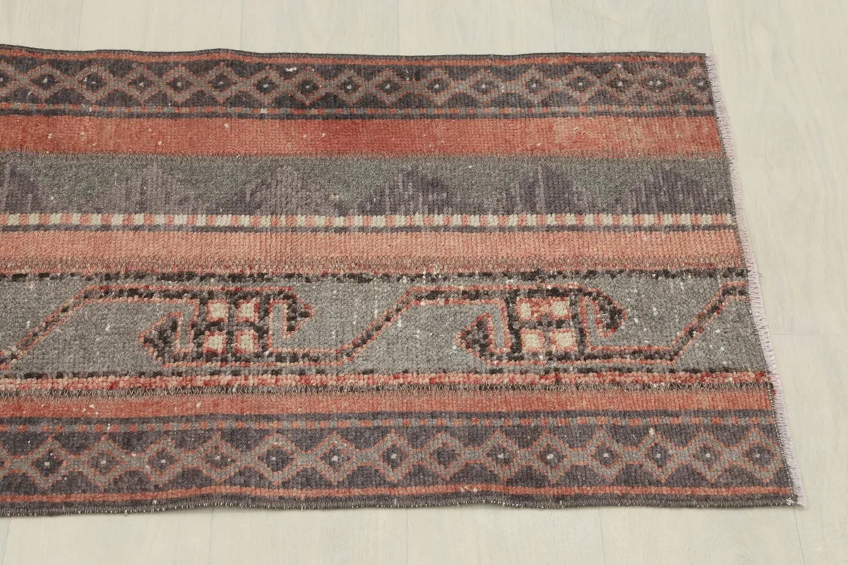 Another overhead view, showing the full width of the rug and the distinct color bands.