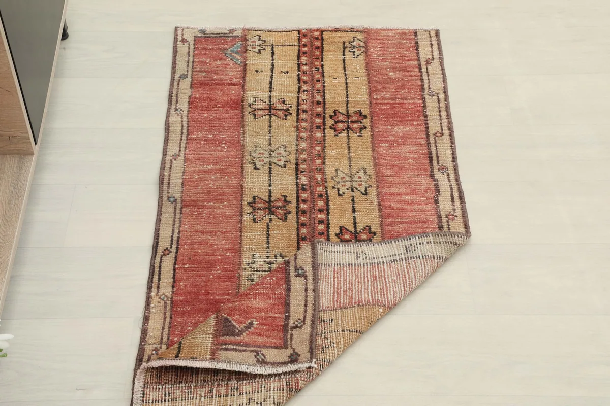The rug partially folded, showing its flexibility and full design