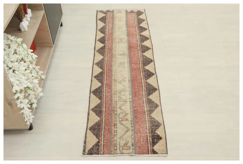 Full top view of the 1'8" x 5'10" vintage Anatolian runner with beige, rust, and charcoal geometric patterns.