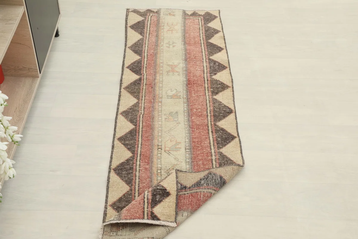 Runner partially folded, demonstrating its pliable nature and full pattern.