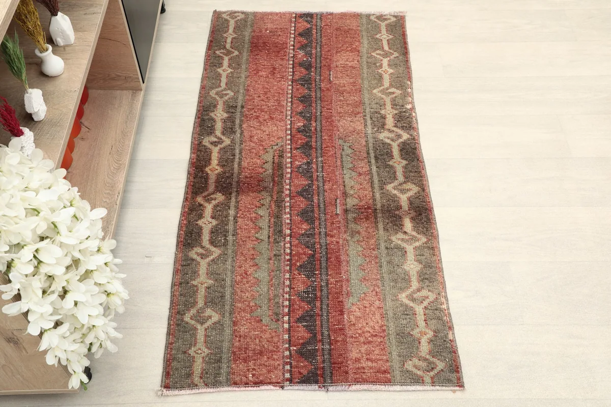 Overhead view showcasing the full length and width of the red and gray striped area rug
