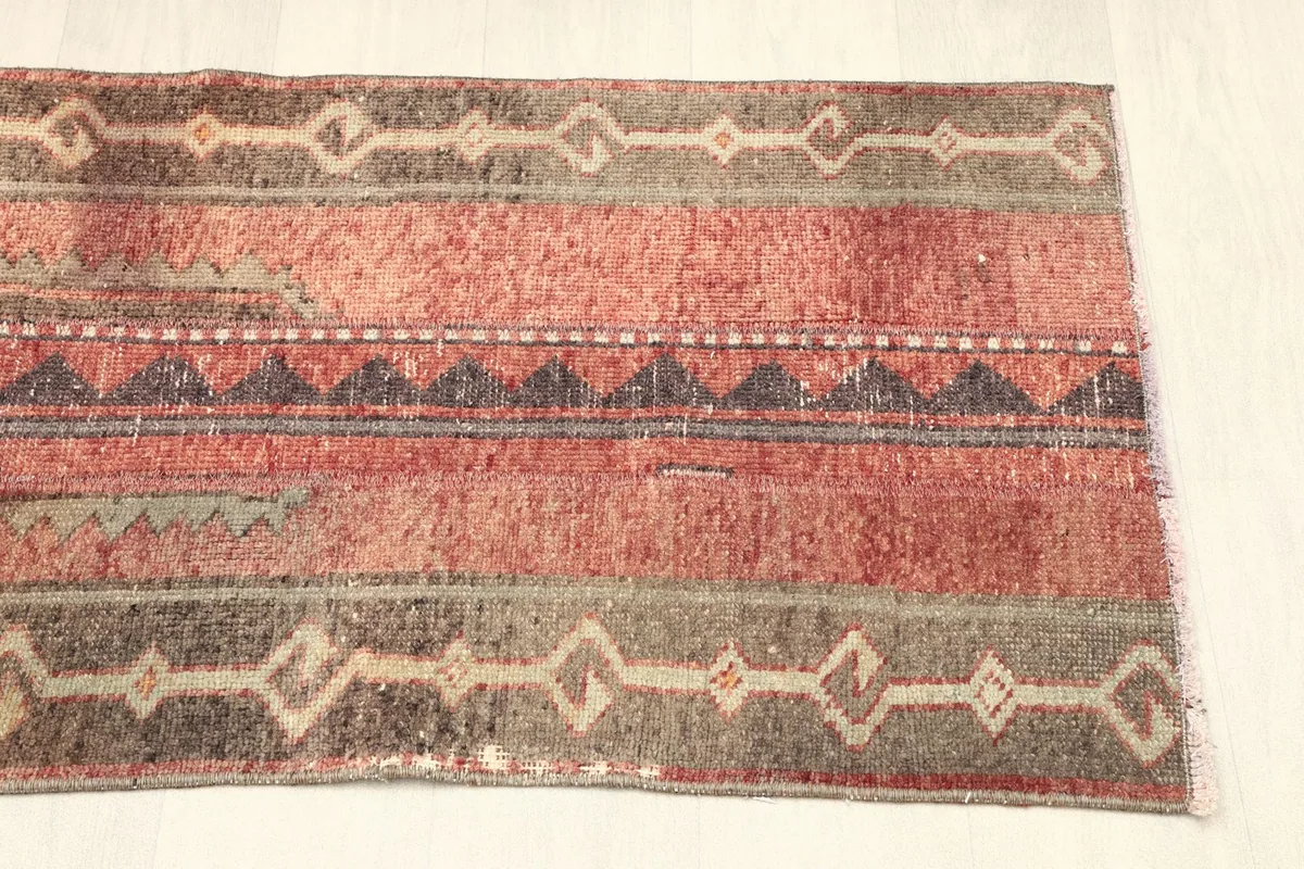 Overhead shot of the other end of the rug, displaying the consistent geometric patterns and colors