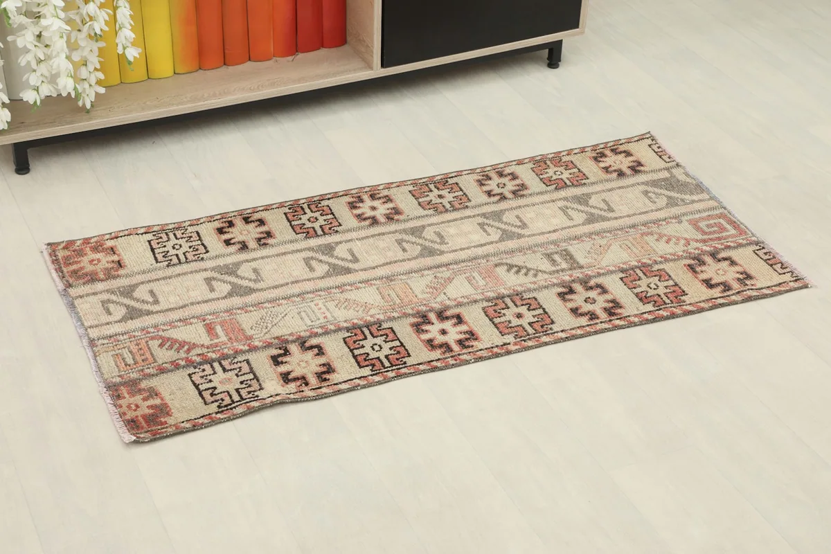 Overhead view of the vintage Anatolian rug, showing its rectangular shape and patterns.