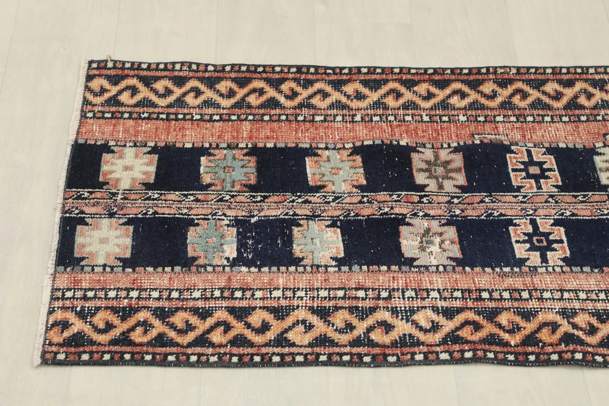 Overhead view focusing on one half of the runner rug, highlighting the repeating patterns.