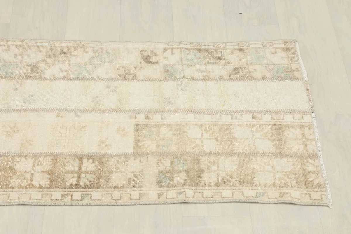 Another angled view of the rug's surface, showcasing the overall blend of neutral tones