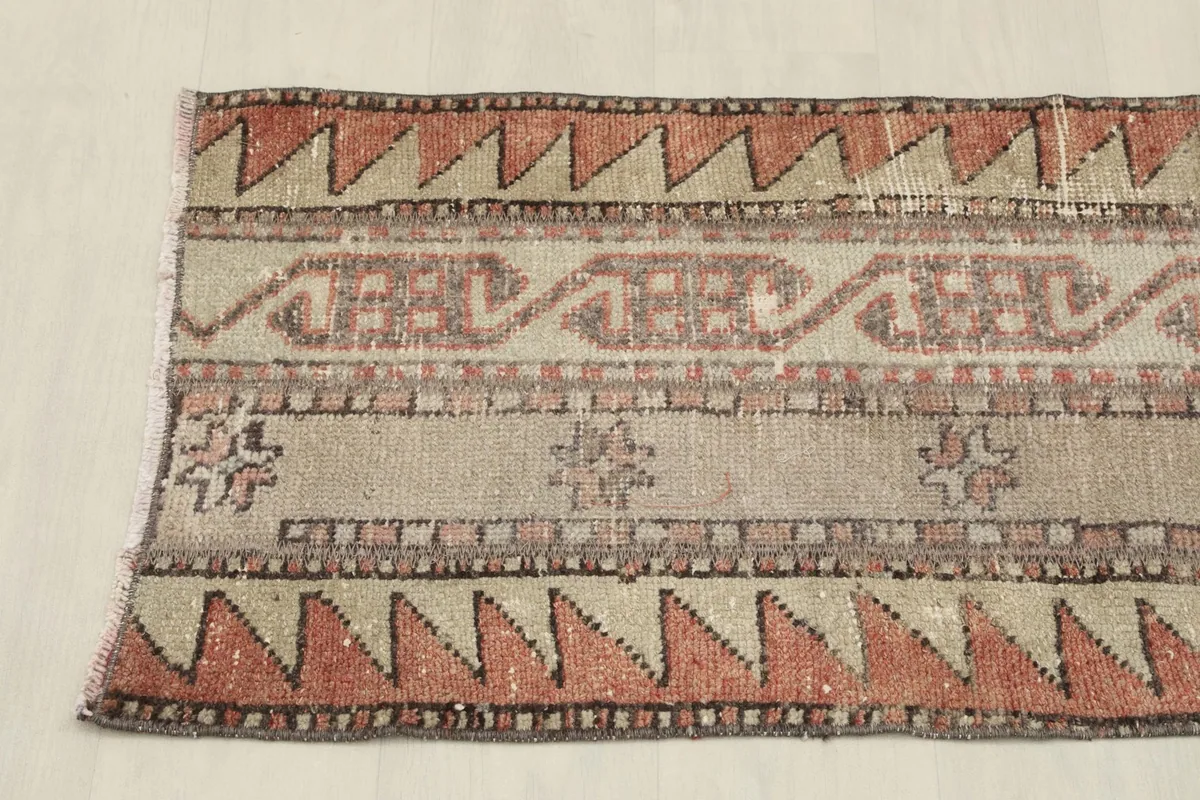 Overhead view of one end of the runner rug, highlighting its repeating geometric design.