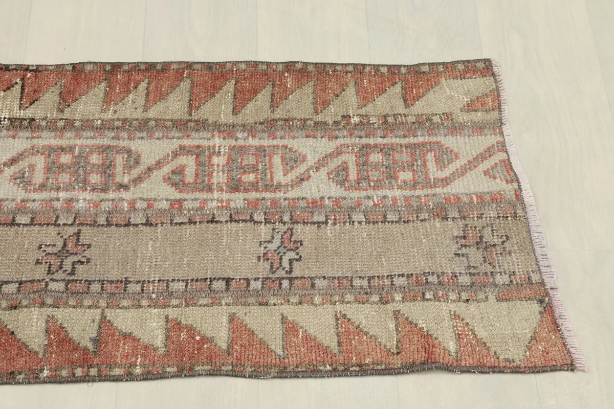 Overhead view of the other end of the runner rug, showcasing the consistent tribal patterns.