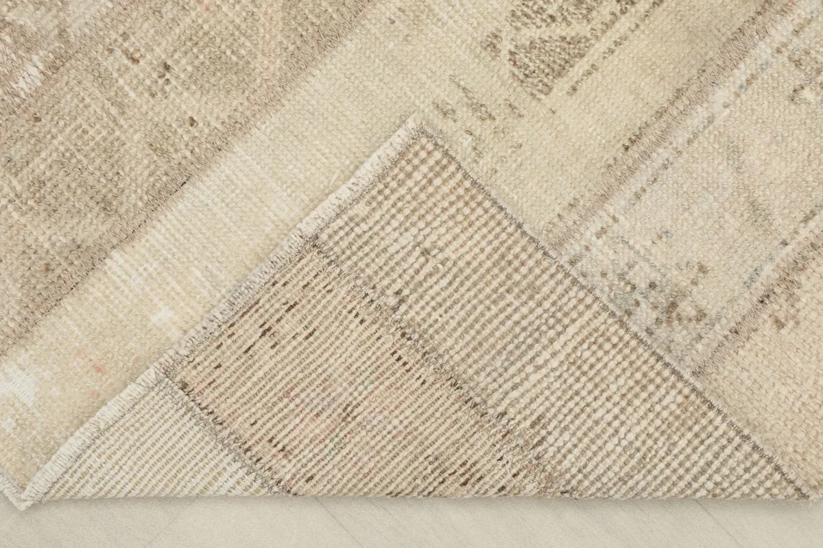 Underside view of the rug, showing the hand-knotted cotton foundation and wool pile construction.