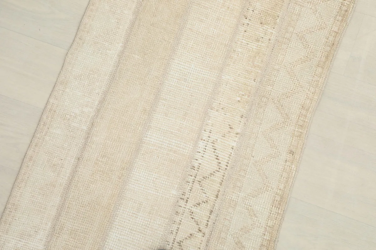 Angled view showcasing the rug's overall texture and the natural color variations in the wool.