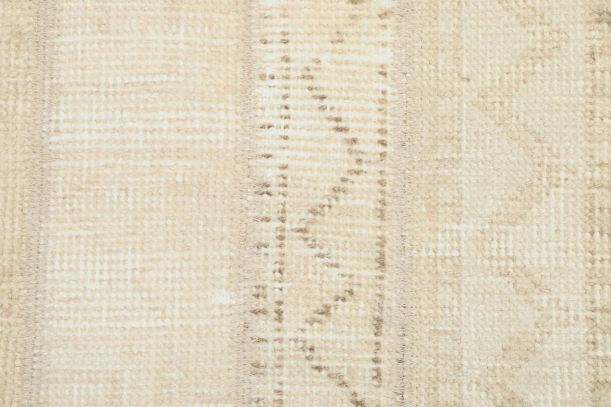 Close-up of the low pile and texture, revealing the hand-knotted wool craftsmanship.