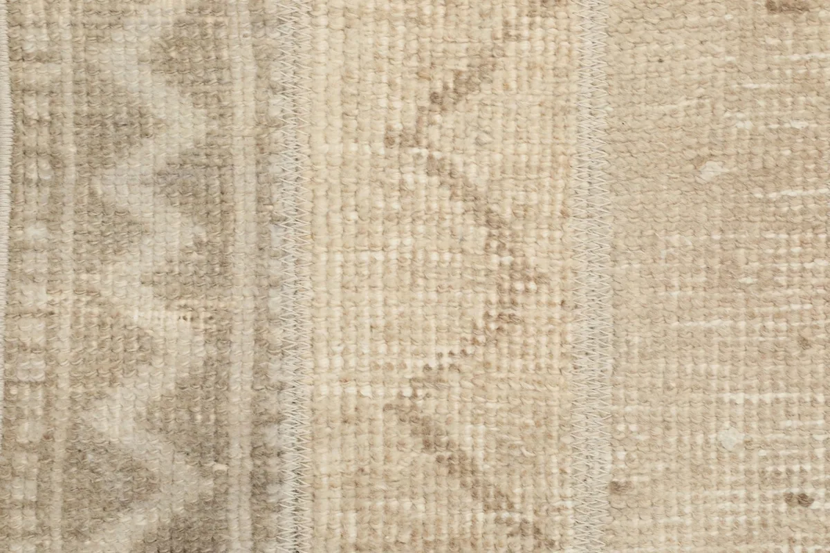 Very close detail view of the low wool pile and hand-knotted texture