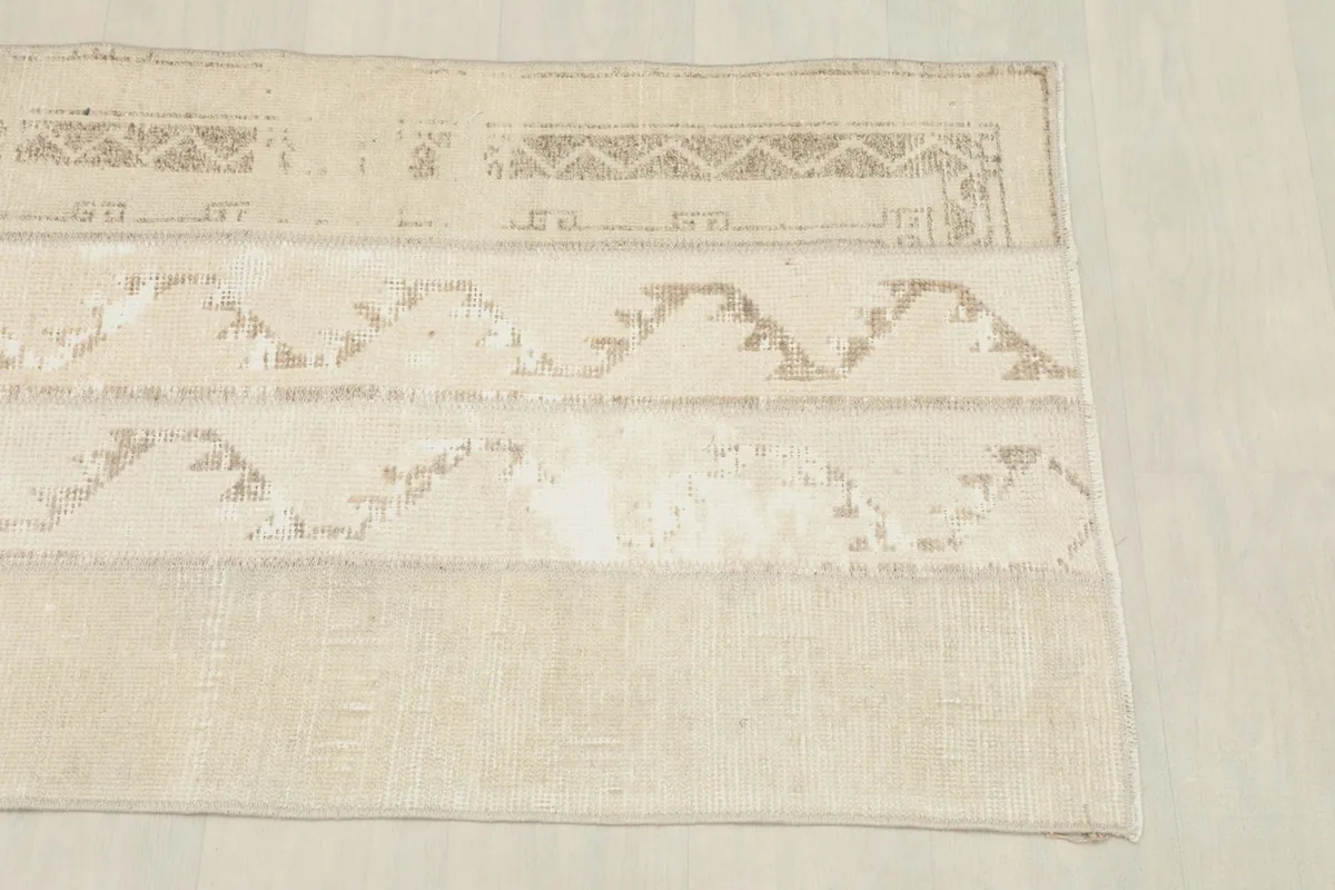 Close-up of the upper left corner showing geometric patterns and border edge