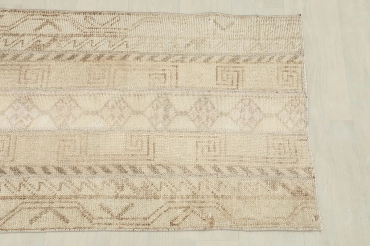 Overhead view showing a section of the rug's geometric and tribal motifs