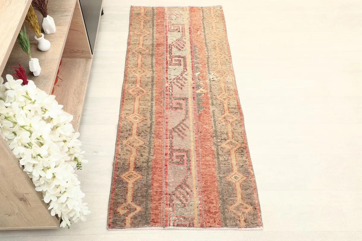 Overhead view of the vintage Anatolian runner rug, highlighting its full pattern and colors.
