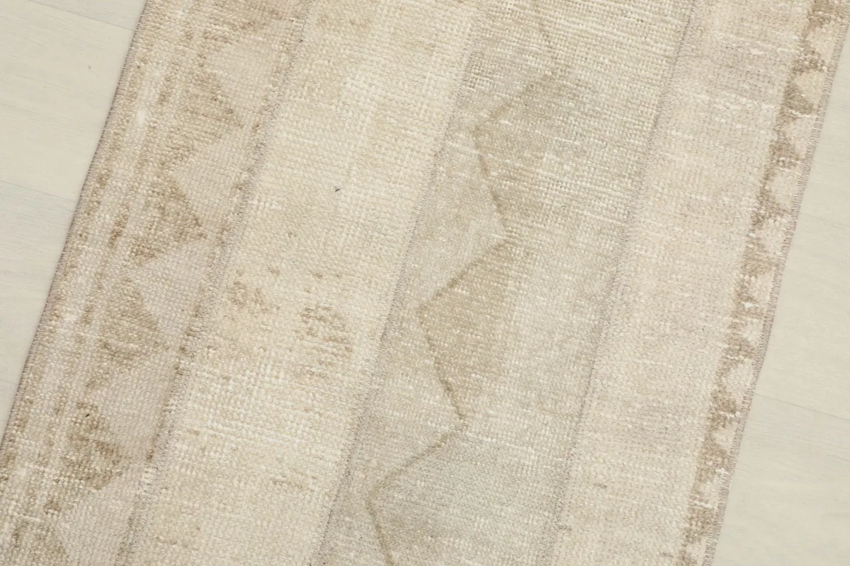 Detailed close-up of the geometric and striped motifs within the vintage wool runner.