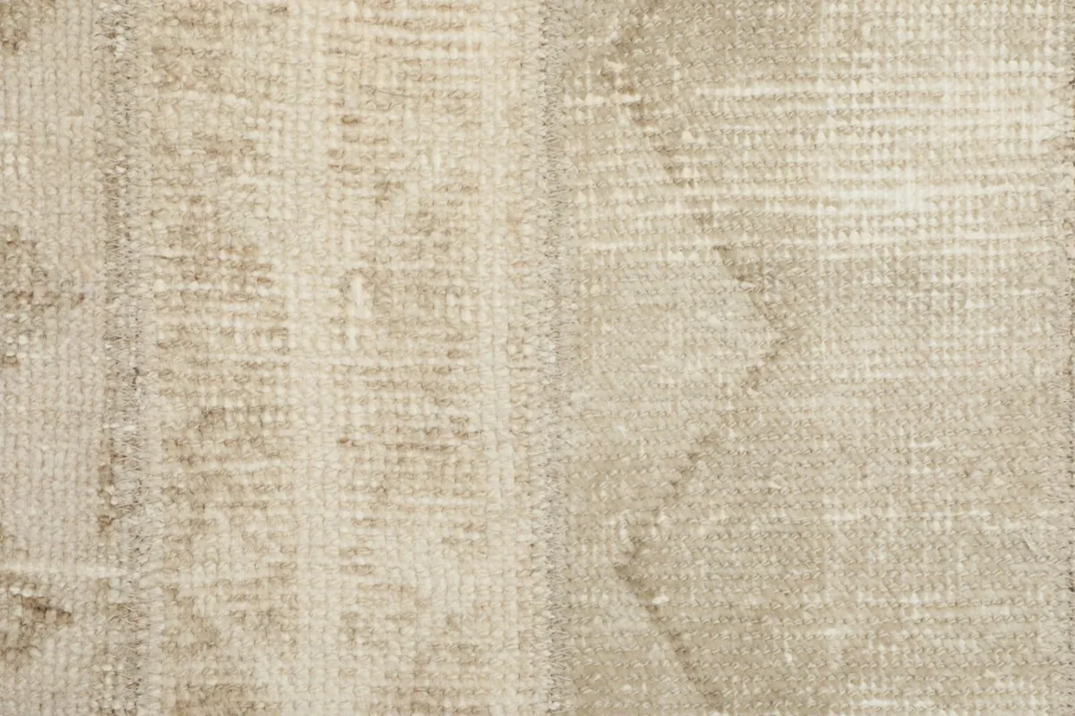 Close-up showing the low wool pile and the intricate knotting of the runner's surface.