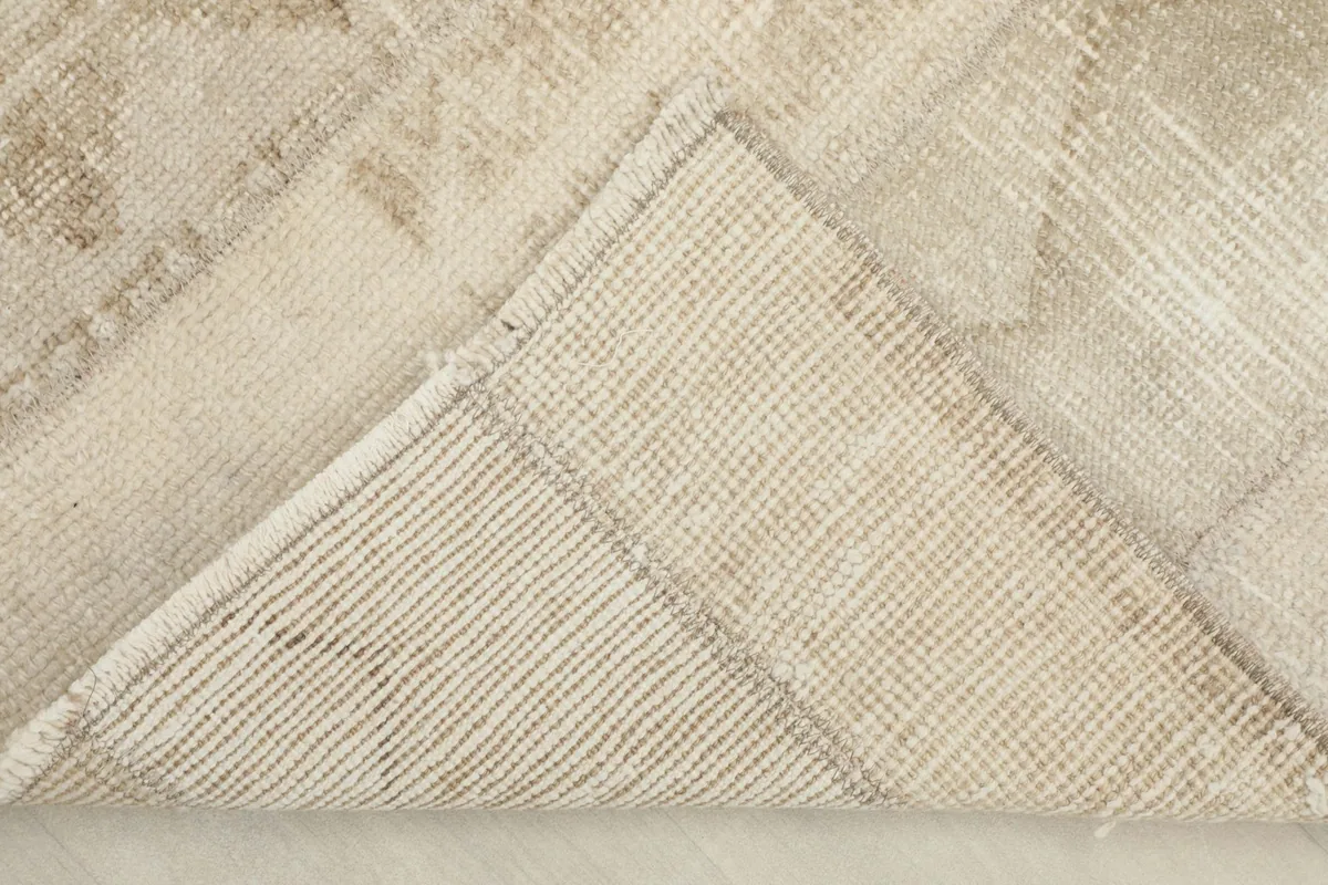 Underside view of a corner of the runner, revealing the hand-knotted cotton foundation.