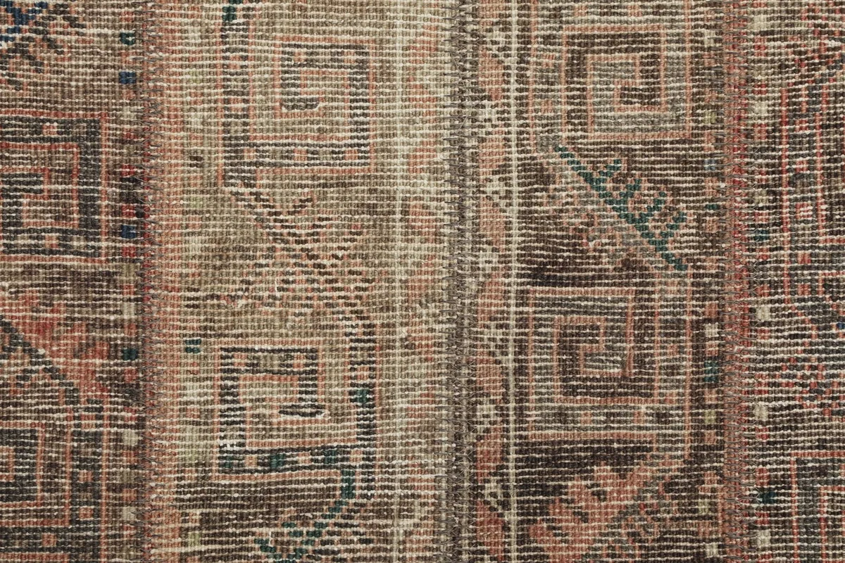 Close-up of the low wool pile, revealing the texture and subtle color variations.