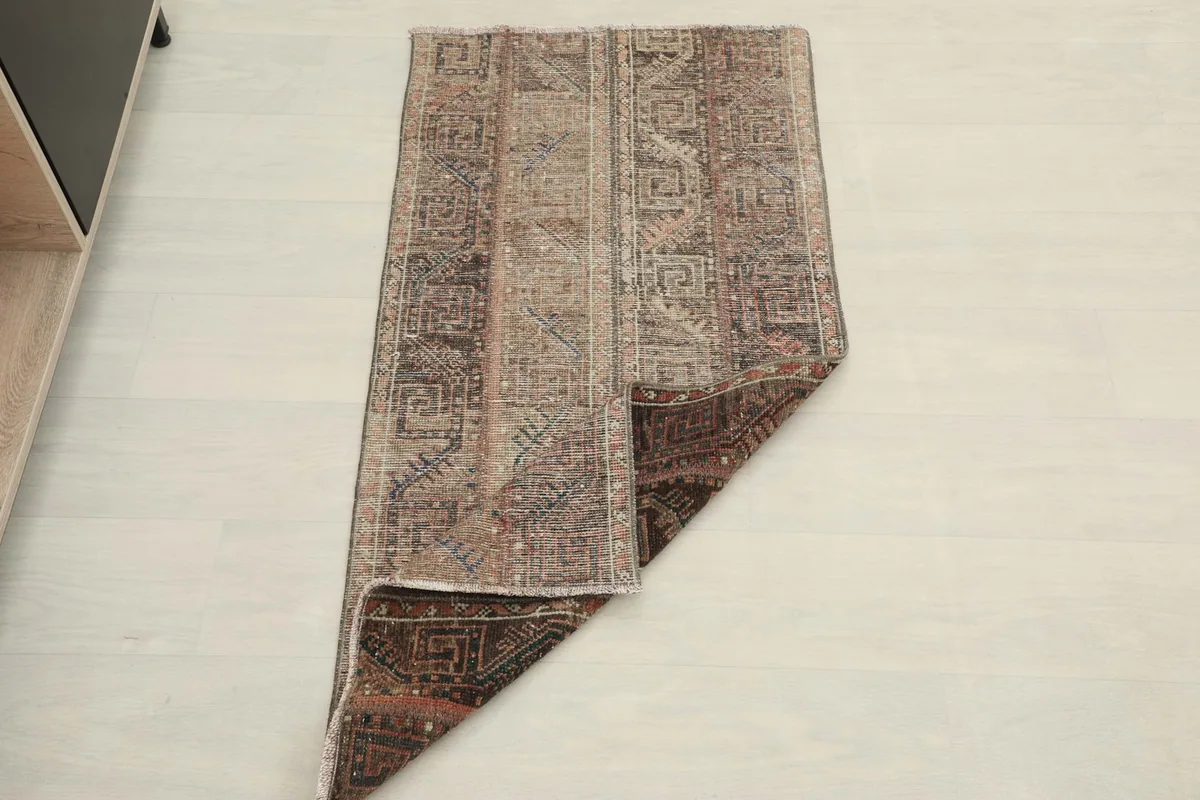The rug folded to reveal both the top and underside, illustrating its flexibility.