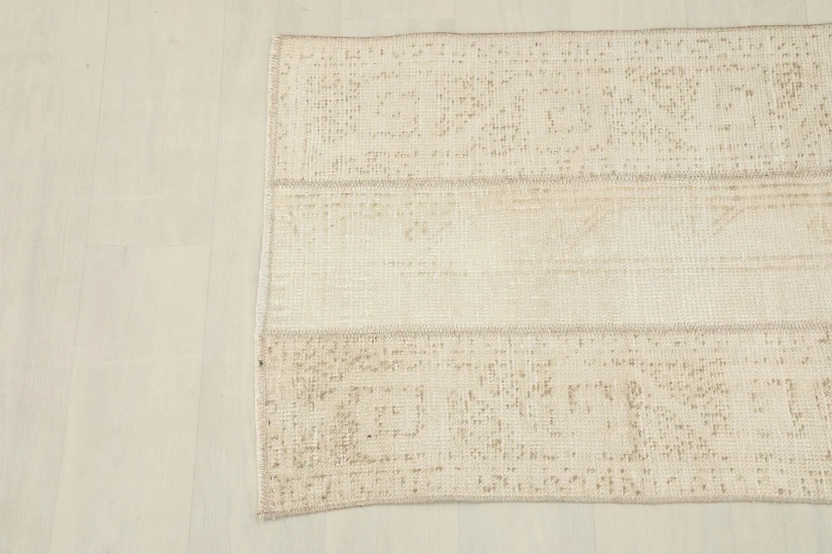 Overhead view showing the full width of the rug and the varied patterns of its panels