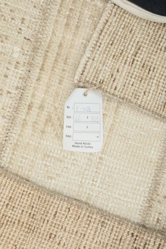 Close-up of the rug's back with a tag indicating 'Hand Made in Turkey'