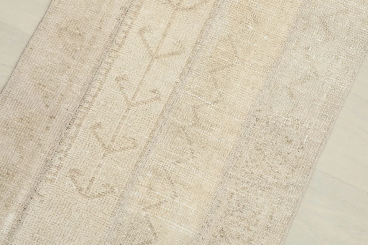 Close-up detail of the rug's central geometric and tribal patterns