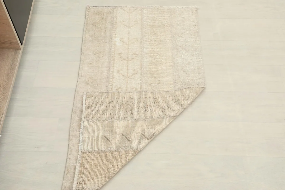 Rug partially folded, illustrating its flexibility and material thickness