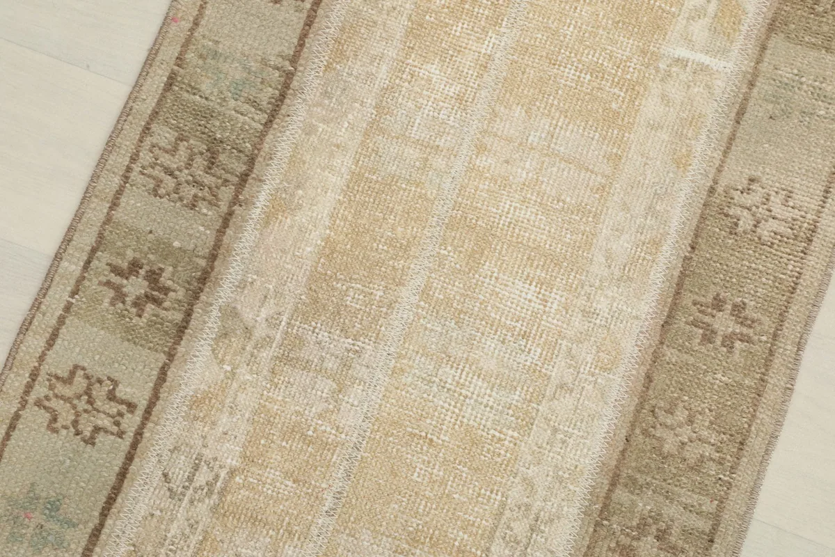 Overhead view focusing on the central panel and one side border with geometric patterns.