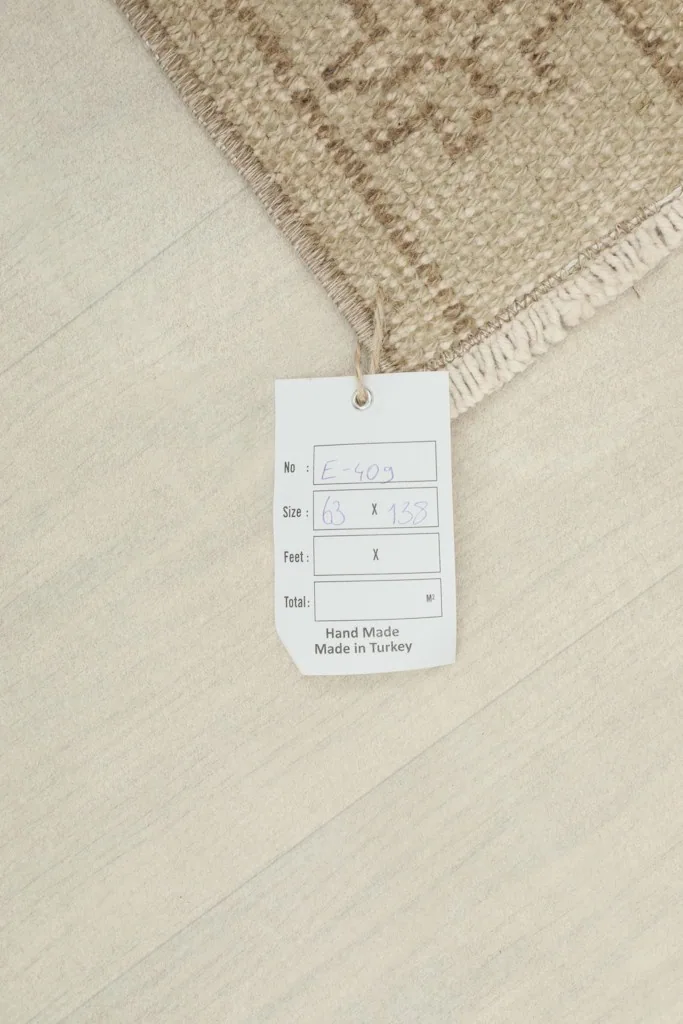Product tag attached to the rug, showing size and origin details.