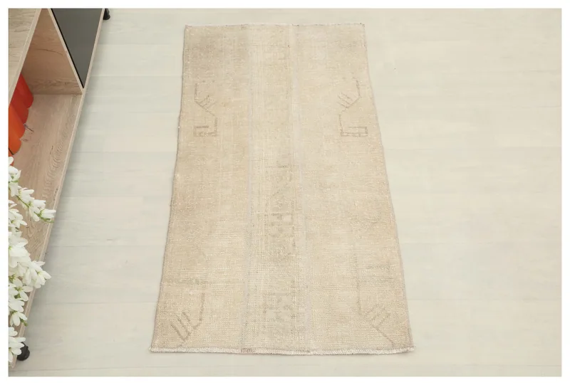 Full top view of the 2x4 beige vintage Anatolian rug on a white background.