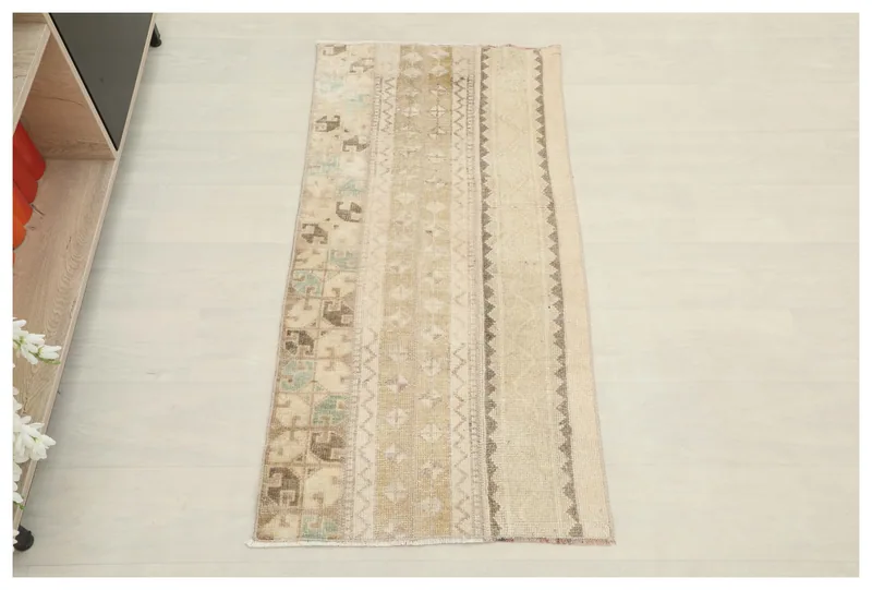 Overhead view of the 2x4 beige geometric striped Anatolian rug