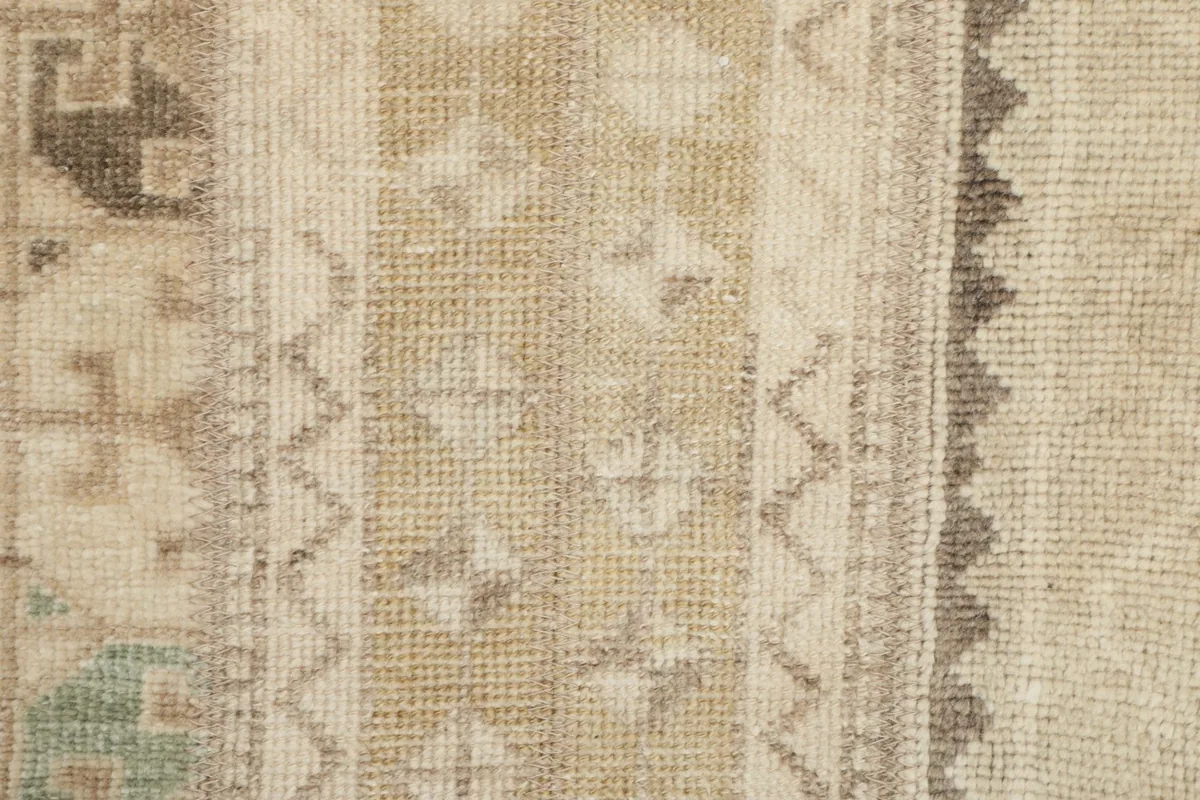Close-up of the low wool pile and hand-knotted texture of the rug