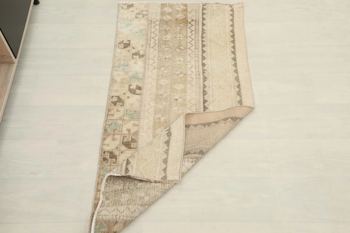Rug partially folded, displaying the flexibility and construction