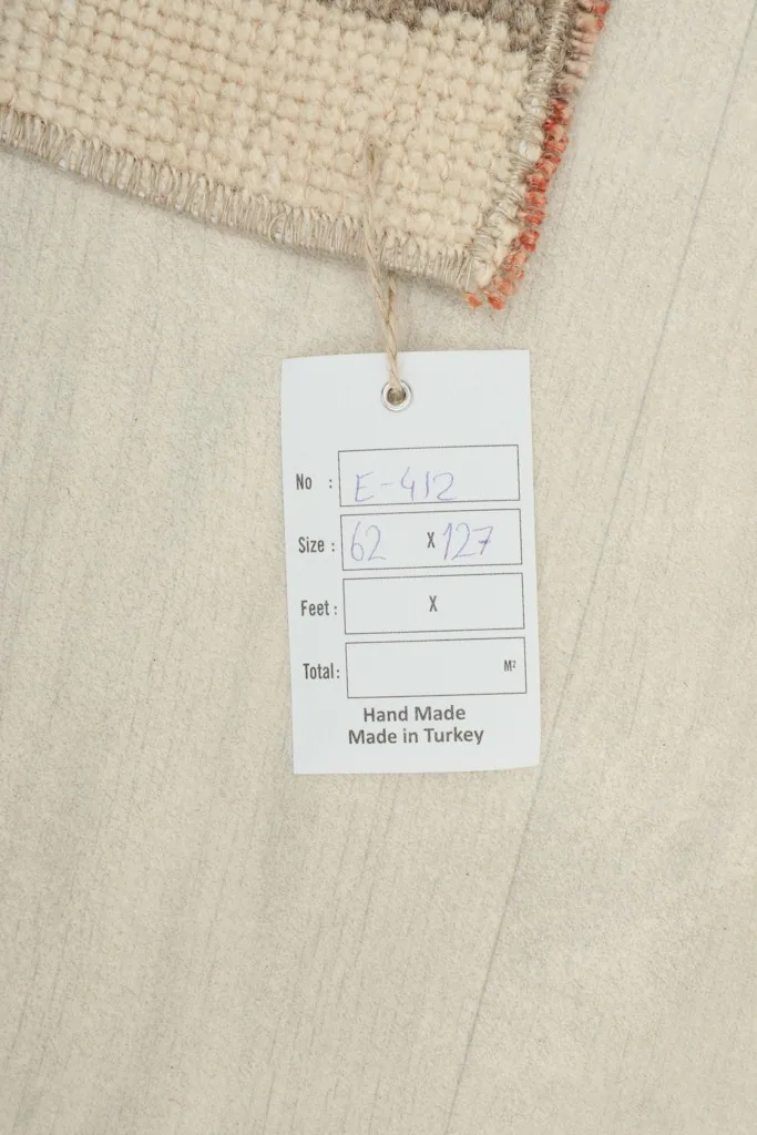 Product tag confirming the rug's size and origin as hand-made in Turkey