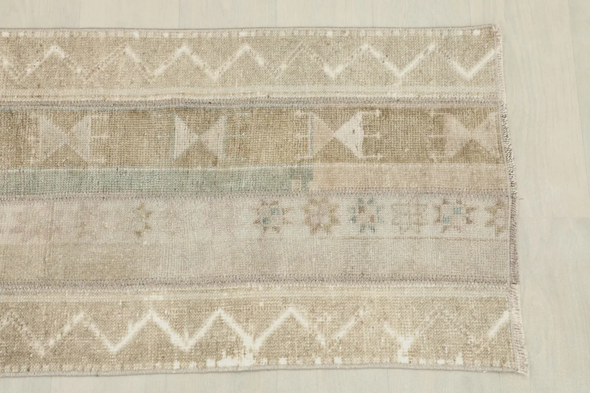 Detailed view of the rug's patterns and colors, highlighting tribal designs