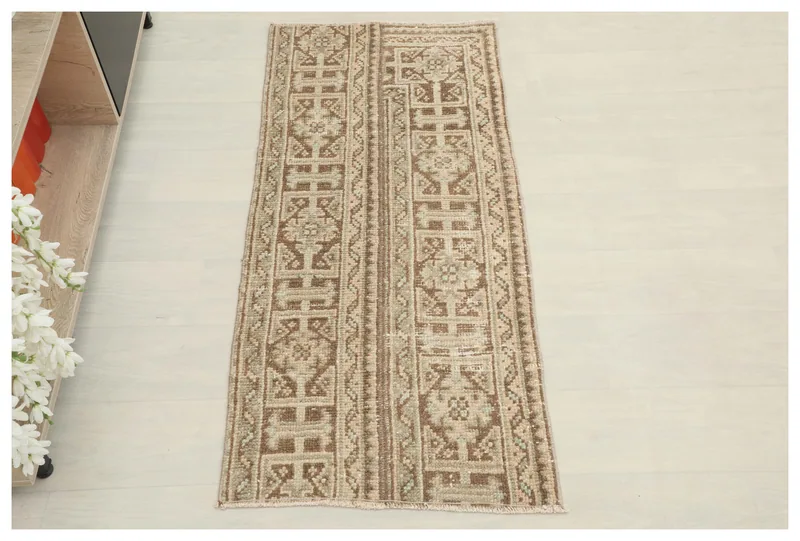 Full top view of the 2'0" x 4'5" brown and beige vintage Anatolian rug on a white background.