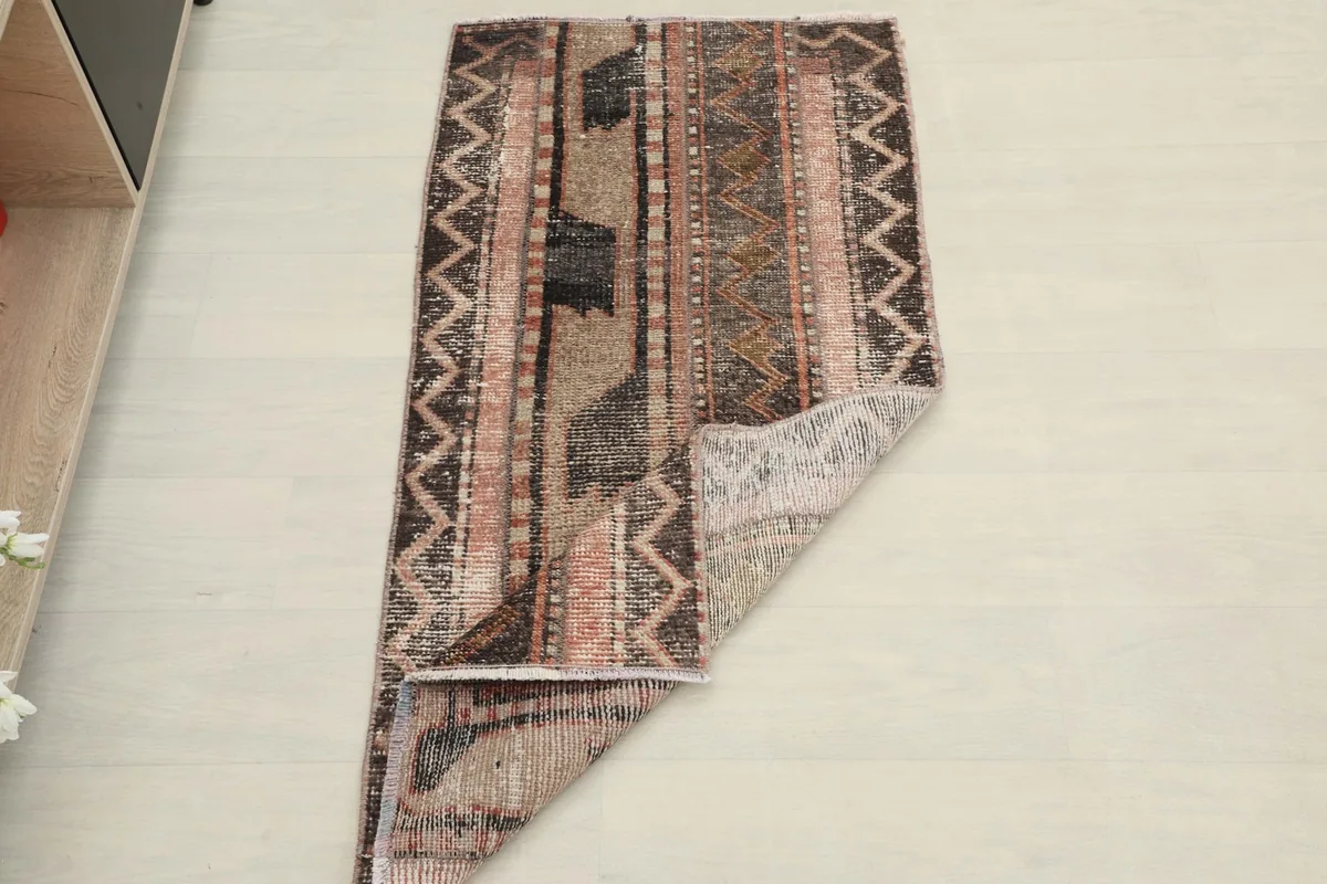 The rug folded to show its flexibility and thickness, displaying the full pattern