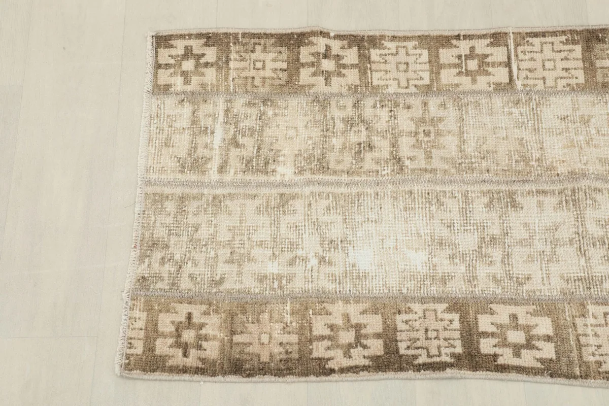 Overhead shot of the other end of the rug, showing the consistent tribal design.