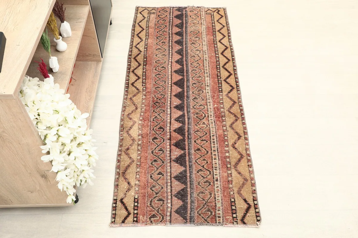 Overhead view of the vintage Anatolian runner, showing its full length and striped tribal patterns