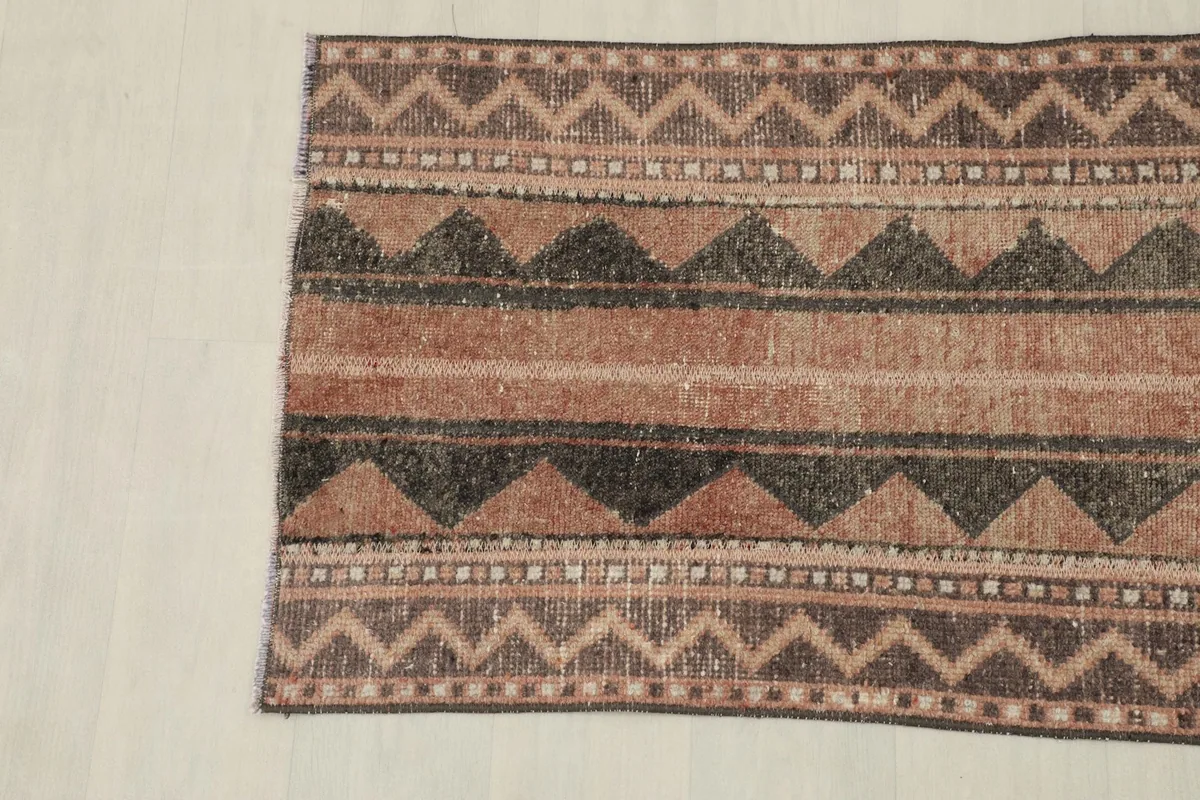 Overhead view of the opposite end, displaying the consistent geometric and striped design.