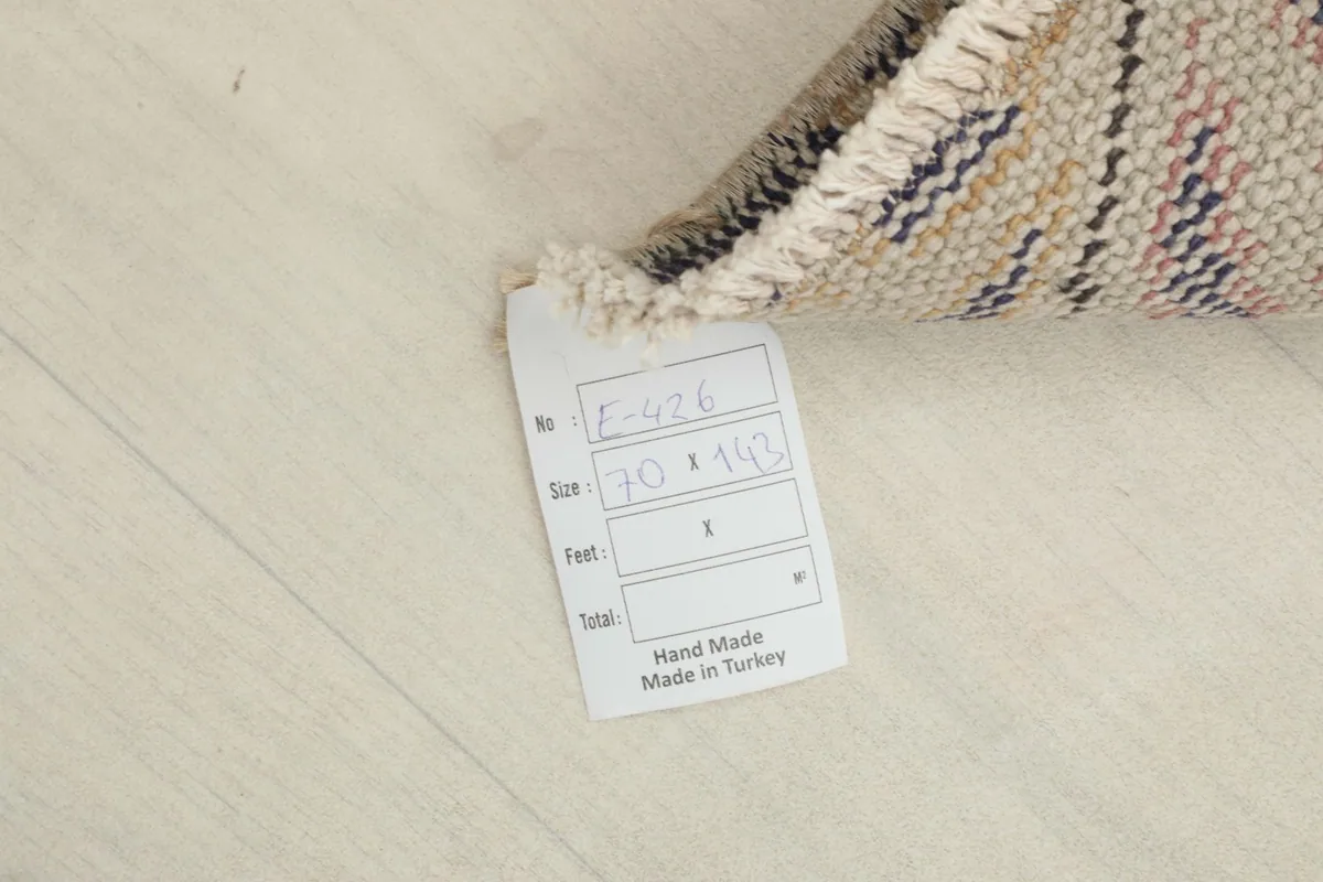 Label showing the rug's size and origin: 70 x 143 cm, hand made in Turkey