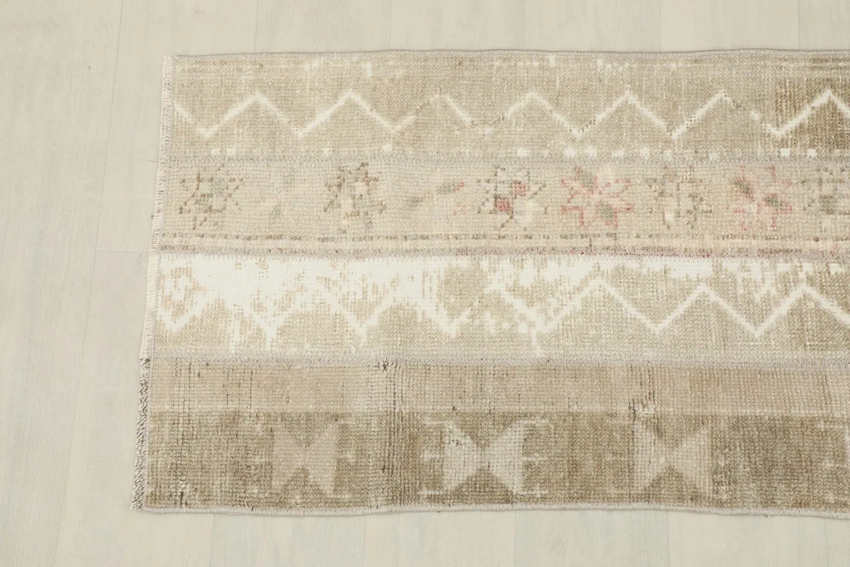 Detailed view of the runner's end, highlighting the chevron and tribal patterns