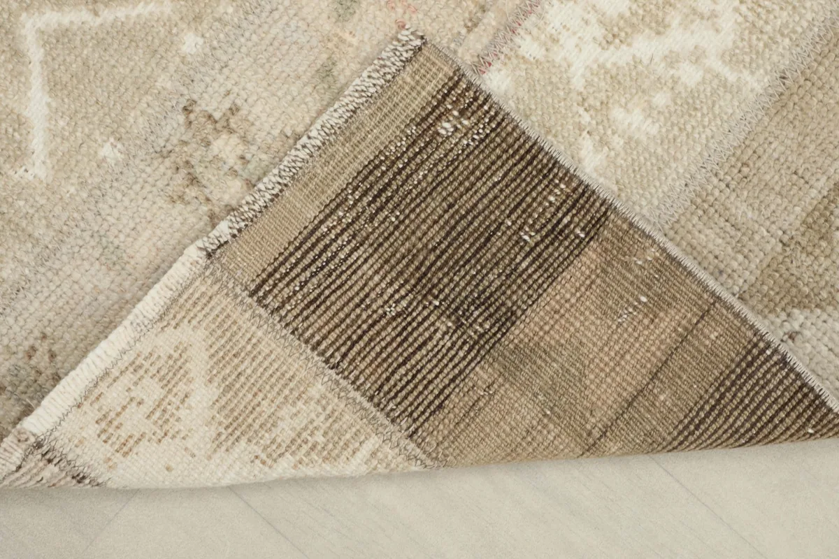 Underside view of the hand-knotted cotton foundation, showing the intricate weave