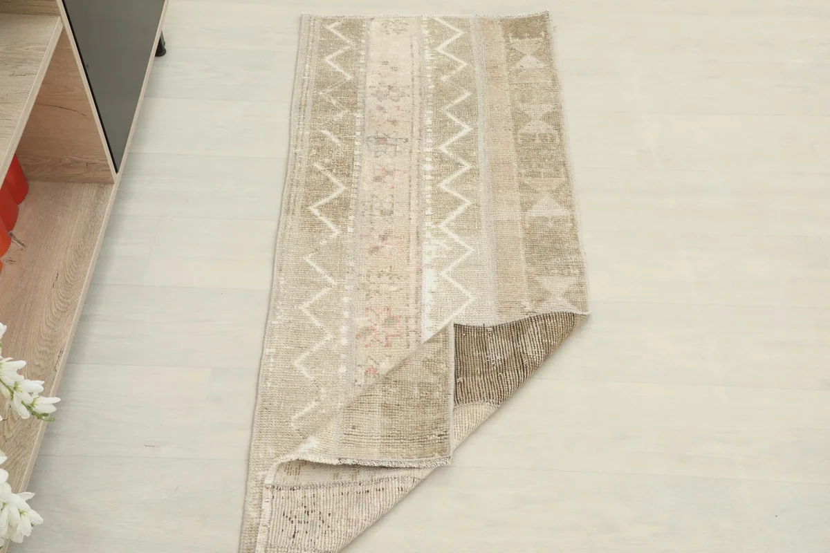 The runner partially folded, showcasing its flexibility and the texture of the pile