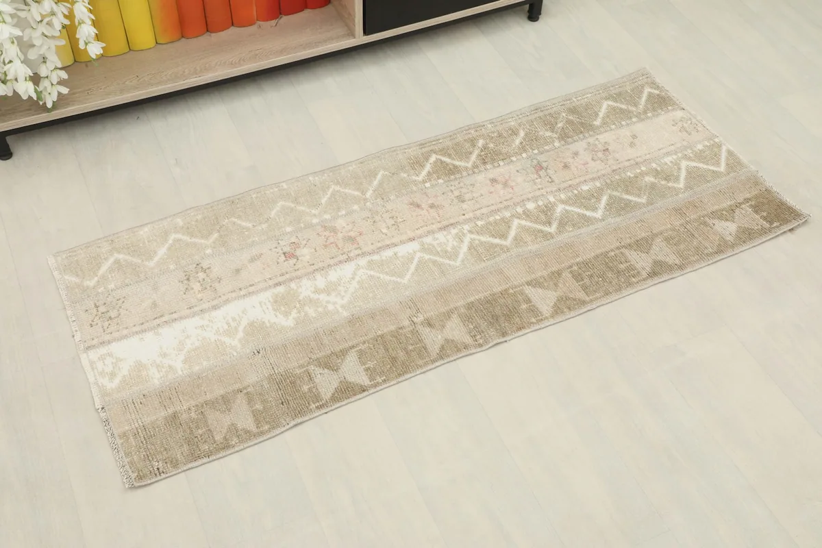 Overhead view of the beige runner showing its full length and patterns from a slight angle